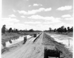 797th Engineer Forestry Company in Burma: Causeway through marsh on the Burma Road.  During WWII.