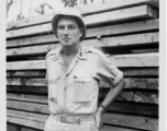 Engineer of the 797th Engineer Forestry Company poses planks in Burma.  During WWII.