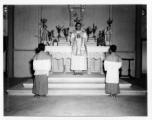 Services at a church in Burma. A western priest leads the ceremony.  In Burma near the 797th Engineer Forestry Company.  During WWII.