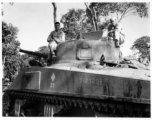 GIs on tank along Burma Road.  797th Engineer Forestry Company in Burma.  During WWII.