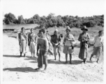 Kachin men on road in Burma.  Near the 797th Engineer Forestry Company.  During WWII.