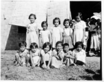 Local kids at a school (likely a missionary school) in Burma.  In Burma near the 797th Engineer Forestry Company.  During WWII.