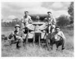 Engineers of the 797th Engineer Forestry Company pose with their catch after a round of huntin' bird in Burma.  During WWII.