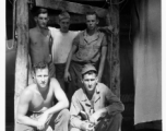 Engineers of the 797th Engineer Forestry Company pose in their tent in Burma.  During WWII.