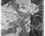 Aerial view of Burma Road bridge under construction amid rice paddies.  During WWII.