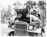 Engineers of the 797th Engineer Forestry Company at work on a truck in Burma.  During WWII.