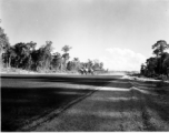 A P-38 on an airstrip in Burma.  Aircraft in Burma near the 797th Engineer Forestry Company.  During WWII.