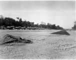 A row of tightly packed American aircraft at at an airstrip in Burma, probably in 1944, including B-25, P-40, C-47, P-47, etc. Apparently they were not concerned about Japanese air raids given the tight layout.  Aircraft in Burma near the 797th Engineer Forestry Company.  During WWII.