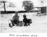 Tom Dunham and local boy in Burma or India.  22nd Bombardment Squadron, in the CBI.