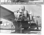 Engine maintenance F-7A/B-24 "The FLYING ANVIL." At Chanyi (Zhanyi), China.  Note the engineer getting a few minutes of rest on the concrete, in the shade below the wing.  24th Combat Mapping Squadron, 8th Photo Reconnaissance Group, 10th Air Force.