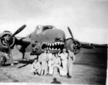 491st Bombardment Squadron personnel with shark-mouth B-25 bomber inside tidy revetment in China: Peterson, unknown, Konkolics (?), Larry Johnson, unknown, Silvernail (?)