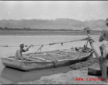GI observes boat carrying produce on river in northern China, a Muslim man at the helm. This is most probably the Yellow River. During WWII.