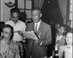 A Chinese VIP reads a speech at a banquet in China during WWII.