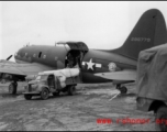A C-46, #296779, loading or unloading cargo in the CBI during WWII.