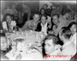 16th Combat Camera Unit members and others--including a few obvious civilians--enjoy a banquet in China during WWII. 