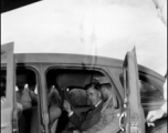 Chennault and an American VIP sit in a car in China during WWII.