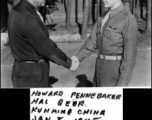 Capt. Howard Pennebaker and Hal Geer, both members of the 16th Combat Camera Unit, shake hands in Kunming, China, on January 8, 1945.