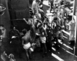 GIs line up for mess on ship on the way back to the US after the war. The ship is probably the SS Marine Raven.