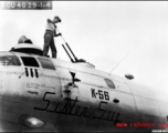 Sgt. Calvin Brown, Kimball, Minnesota, cleans the upper forward guns of the 20th Bomber Command Boeing B-29 Superfortress "Sister Sue".  China.  40th Bomb Group.