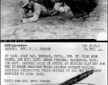 At 52nd Army HQS, Yenshan, China, 2nd Lt. Wang Mong Chien, 2nd Division; Capt. Merle Foraker, Barberton, OH.  The Capt. changes angle of antenna on British B-48 set for use in prone position while Chinese student watches. 