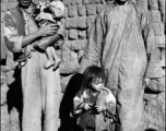 Local people in a village in China, probably in Yunnan province.  From the collection of Wozniak, combat photographer for the 491st Bomb Squadron, in the CBI.