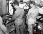 Photographic technicians at work in a photo lab somewhere in the CBI.