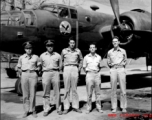 Officers of the 22nd Bombardment Squadron stand before one of the squadron's B-25's (C or D model) at Chakulia Air Base, India.