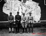 Chinese soldiers in the CBI standing before mural. During WWII.