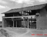 A house under construction in a village in Yunnan province, China. During WWII.