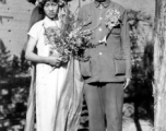 A wartime wedding in Yunnan province, China, with a very young and unenthusiastic bride. 