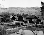 A village near Yangkai and local people in Yunnan province, China.  From the collection of Eugene T. Wozniak.