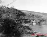 A covered pedestrian bridge in Yunnan province, China. During WWII.