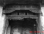 Wood carvings around the door of a compound that has been taken over for use by the Nationalist government. Architecture in Yunnan province, China.