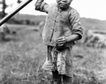 Local farm boy in Yunnan, China, during WWII.