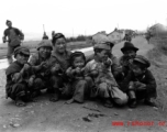 Local kids roadside in China give a 'ding hao' thumbs up during WWII.  From the collection of Eugene T. Wozniak.