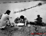 Local women in Yunnan province, China wash clothes by hand during WWII.