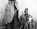 Local people in Yunnan province, China, during WWII.  The man on the left is wearing typical clothing of the Yi ethnic group.  From the collection of Eugene T. Wozniak.