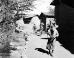 Local people in China: Villagers move around village.  From the collection of Eugene T. Wozniak.