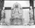 Figures in a Buddhist temple in Yunnan province, China, during WWII.