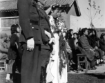 A group wedding in Yunnan province, China, during the hard war years of WWII.  Many of the grooms would have been soldiers and group weddings really came into style at around or just before the war years.