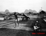 A Chinese laborer hauling logs in Guangxi province in southwest China, during WWII, in 1945.