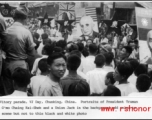 VJ Day victory parade in Chongqing, with crowds carrying portraits of President Truman and G'mo Chiang Kai-shek, along with Union Jack. In the CBI.