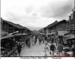 A main market street in the town on Pouschan (now Baoshan 保山市) in Yunnan, along the Ledo/Burma Road in 1945.