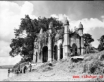 An overgrown riverside structure in the countryside of India or Burma, during WWII.