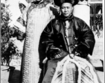 A wealthy family in Manchu dress during WWII in the CBI.  Photo from Henry Herbert.