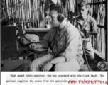 High speed radio operator working from a bamboo hut in the jungle, the key operated by his right hand. His partner supplies the power from a generator with a two-handed crank.  US Signal Corps photo.