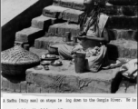 Sadhu holy man on steps to Ganges River during WWII.  Photo from Delbert J. Wood.