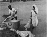 Dhobi wallas doing laundry in India during WWII.