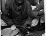 Food seller in India during WWII.  Photo from S. Louff.