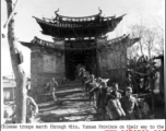 Chinese troops march through Mitu, Yunnan province, on their way to the battleground.  US Army Signal Corps photo.